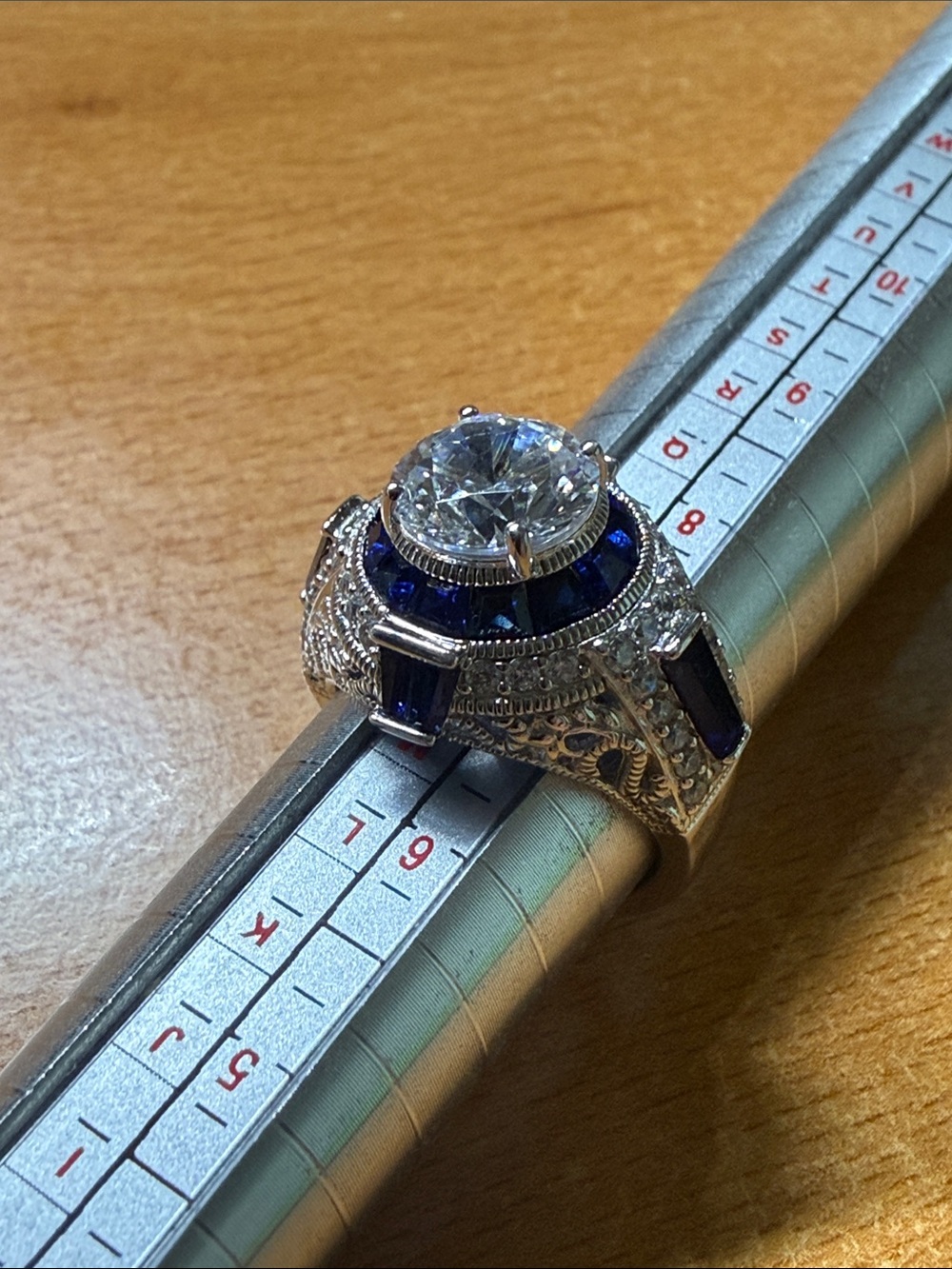 Vanna K. Silver ring with diamond simulant and lab-grown sapphires, size 7